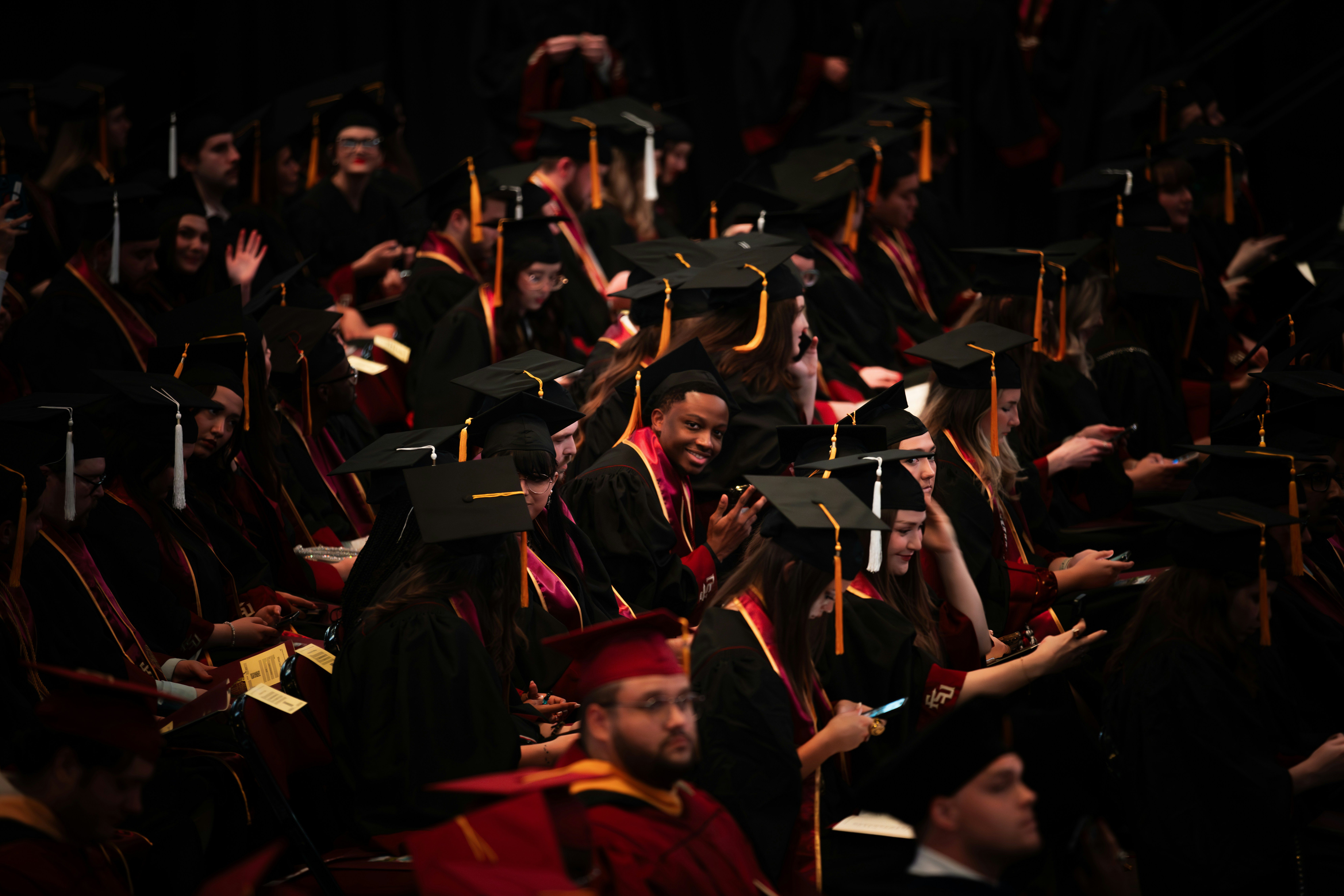 college students sitting at graduation ceremony