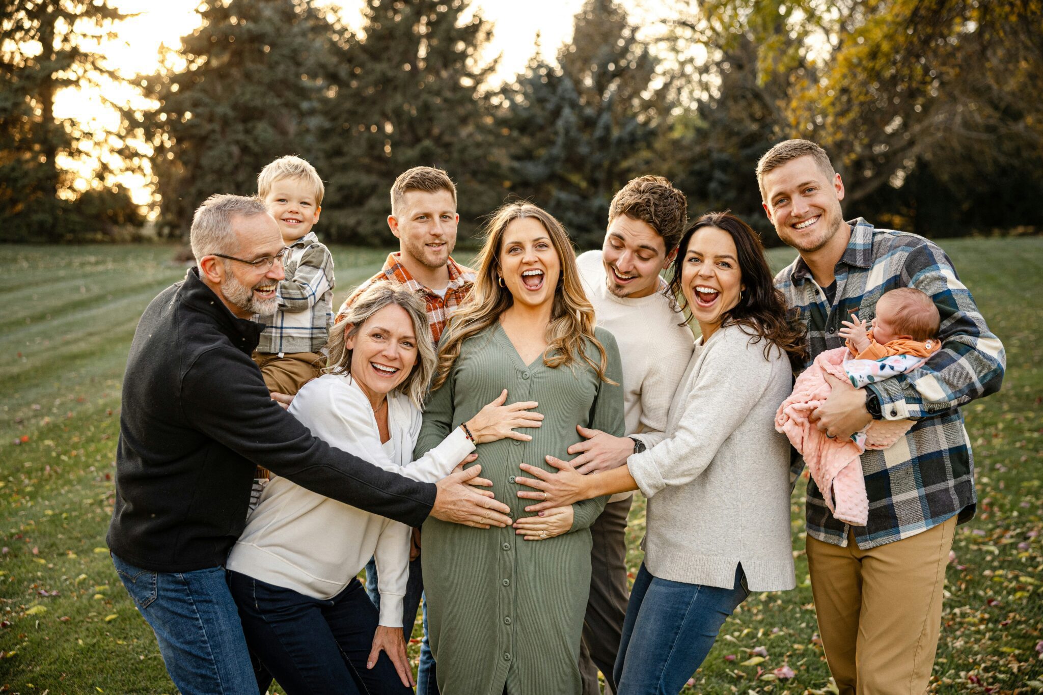 Multi-generational family smiling together outdoors representing generational wealth and family values