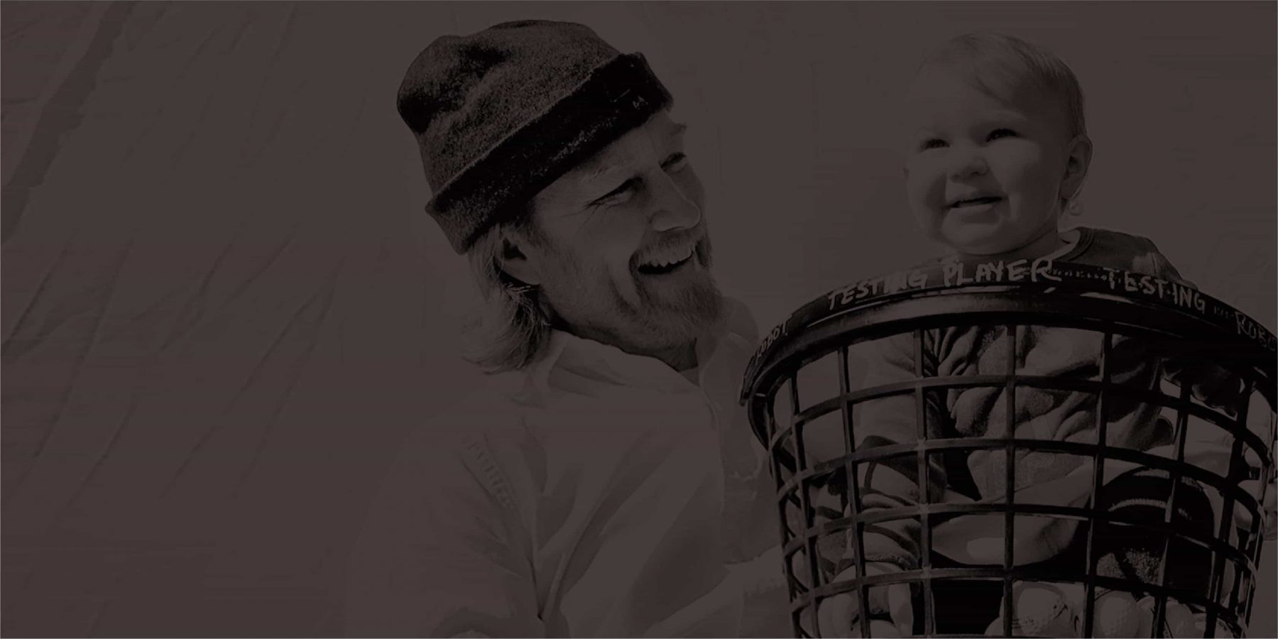 Picture of a smiling man and his baby