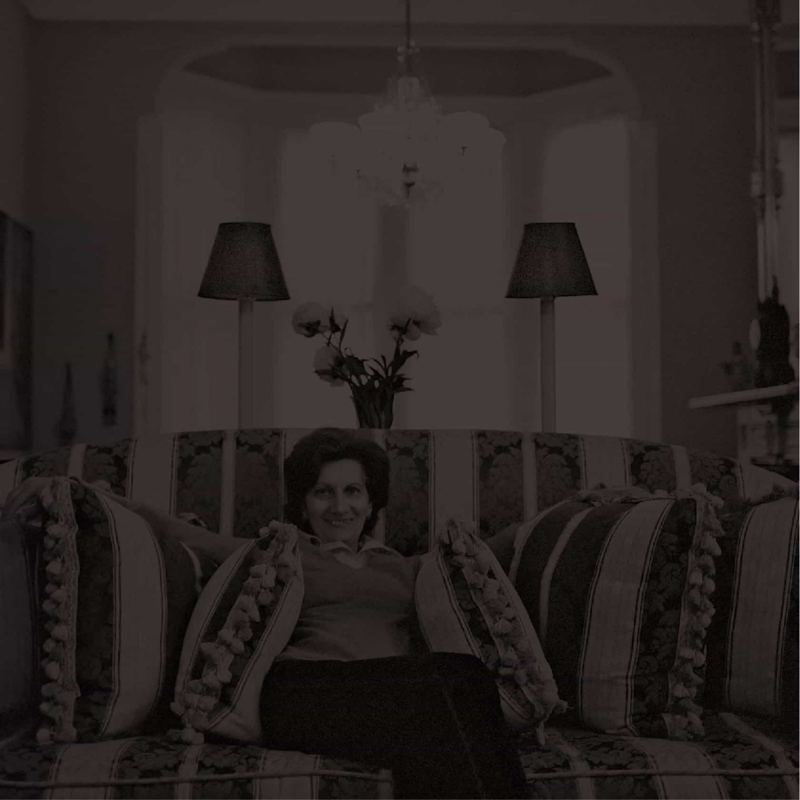 Picture of a happy woman sitting in a sofa